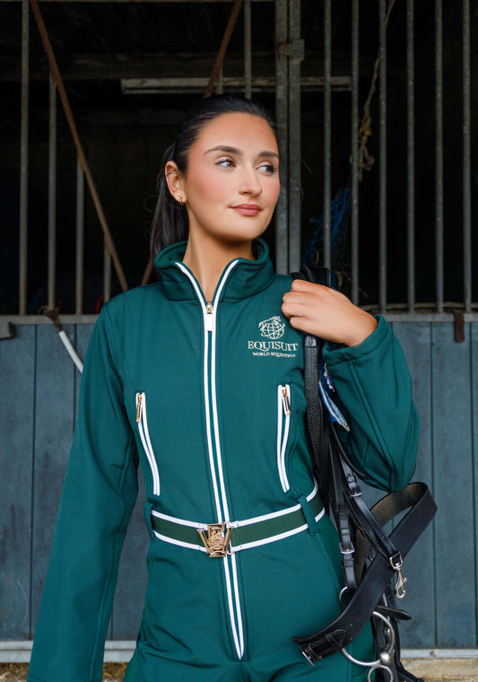 Woman wearing the Hunter’s Grove Equisuit® holding a bridle – stylish and practical horse riding clothes for everyday equestrian life.